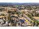 Beautiful aerial view of the estate, highlighting surrounding greenery, lake, and distant city views at 1 Random Rd, Englewood, CO 80113