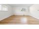 Bright bedroom with wood floors and modern window design at 1 Random Rd, Englewood, CO 80113