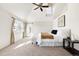 Bright, airy main bedroom with vaulted ceiling, ceiling fan and access to a private outdoor space at 1 Random Rd, Englewood, CO 80113