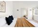 Serene bedroom featuring neutral decor, a high ceiling, and ample natural light at 1 Random Rd, Englewood, CO 80113