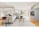 Cozy living room with a fireplace, hardwood floors, and large windows at 1 Random Rd, Englewood, CO 80113