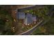Aerial view of a secluded home nestled among trees, featuring a spacious deck and outdoor seating at 26116 Chief Hosa Rd, Golden, CO 80401