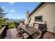 Spacious deck with dining set, mountain views, and outdoor buffet at 26116 Chief Hosa Rd, Golden, CO 80401