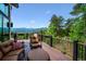Inviting outdoor deck area with comfortable seating and stunning mountain views at 26116 Chief Hosa Rd, Golden, CO 80401