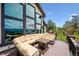 Open deck with mountain views and outdoor seating area with corner sofa at 26116 Chief Hosa Rd, Golden, CO 80401