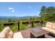 Open deck with mountain views and comfortable outdoor seating area at 26116 Chief Hosa Rd, Golden, CO 80401