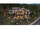 Expansive home with multiple decks, outdoor living spaces, and beautifully landscaped grounds at 26116 Chief Hosa Rd, Golden, CO 80401