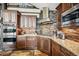 Well-equipped kitchen with granite countertops, stainless steel appliances, and ample cabinet space at 26116 Chief Hosa Rd, Golden, CO 80401