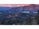 A stunning vista of snow-capped mountains in a winter landscape at 26116 Chief Hosa Rd, Golden, CO 80401