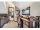 Cozy office nook features a rustic wooden desk, chair, and views of the outdoors at 26116 Chief Hosa Rd, Golden, CO 80401