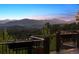 Panoramic mountain views from the home's deck, showcasing beautiful scenery and outdoor living at 26116 Chief Hosa Rd, Golden, CO 80401
