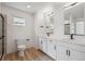 Bathroom featuring double sinks with modern lighting, and sleek black hardware at 691 N Tempe St, Aurora, CO 80018