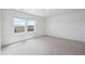 Spacious bedroom with carpet and two large windows at 691 N Tempe St, Aurora, CO 80018
