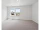 Spacious bedroom featuring neutral carpet and two windows with great views at 691 N Tempe St, Aurora, CO 80018