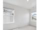 Bright bedroom showcasing two windows offering ample natural light at 691 N Tempe St, Aurora, CO 80018