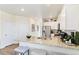 Modern kitchen with white cabinets, stainless steel appliances, and spacious granite countertop at 691 N Tempe St, Aurora, CO 80018