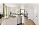 Modern open-concept kitchen and living room, featuring stainless appliances and an inviting atmosphere at 691 N Tempe St, Aurora, CO 80018
