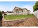 Well-maintained backyard with a stone retaining wall at 9040 Grand Mesa Ave, Longmont, CO 80504