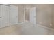 Neutral bedroom featuring carpet, closet, and doorway at 9040 Grand Mesa Ave, Longmont, CO 80504