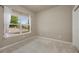 Bright bedroom with carpeted floor and a large window at 9040 Grand Mesa Ave, Longmont, CO 80504