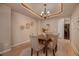 Elegant dining room with decorative ceiling and chandelier, perfect for Gathering gatherings at 9040 Grand Mesa Ave, Longmont, CO 80504