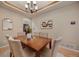 Warm and inviting dining room with decorative touches and a seamless flow to the kitchen at 9040 Grand Mesa Ave, Longmont, CO 80504