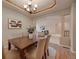 Charming dining room with ample seating and an open layout, ideal for entertaining guests at 9040 Grand Mesa Ave, Longmont, CO 80504