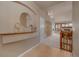 Elegant foyer with decorative accents, opening to a spacious living area with a cozy fireplace at 9040 Grand Mesa Ave, Longmont, CO 80504