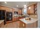 Modern kitchen with sleek black appliances, light countertops, and light-colored cabinets at 9040 Grand Mesa Ave, Longmont, CO 80504