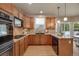 Updated kitchen with stainless steel appliances, light countertops, and stylish cabinets at 9040 Grand Mesa Ave, Longmont, CO 80504