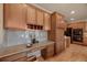 Beautiful kitchen area featuring light wood cabinets, granite countertops, and stylish decor at 9040 Grand Mesa Ave, Longmont, CO 80504