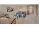Inviting living room featuring a gray sofa, neutral walls, and abundant natural light at 9040 Grand Mesa Ave, Longmont, CO 80504
