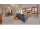 Spacious living room with a cozy fireplace, large windows, and an open concept design at 9040 Grand Mesa Ave, Longmont, CO 80504