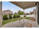 Covered patio overlooking green yard and privacy fence at 9040 Grand Mesa Ave, Longmont, CO 80504
