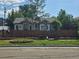 Charming cottage-style home with a well-maintained front yard, complemented by a quaint fence and lush greenery at 4368 Benton St, Denver, CO 80212