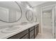Bright bathroom with double sinks, modern vanity, and stylish mirrors, offering a functional design at 6738 Esmeralda Dr, Castle Rock, CO 80108