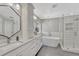 Luxurious bathroom with double vanity, soaking tub, and glass-enclosed shower for a spa-like retreat at 6738 Esmeralda Dr, Castle Rock, CO 80108