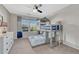 Stylish bedroom with a bunk bed, ceiling fan and modern curtains that complement the room's design at 6738 Esmeralda Dr, Castle Rock, CO 80108