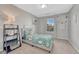 A cozy bedroom features a patterned comforter and a leaning ladder shelf by the window at 6738 Esmeralda Dr, Castle Rock, CO 80108