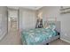 Bedroom featuring a modern bed with a printed comforter, complemented by a leaning shelf at 6738 Esmeralda Dr, Castle Rock, CO 80108