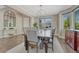 Dining room features ample natural light, wood floors, and modern light fixtures at 6738 Esmeralda Dr, Castle Rock, CO 80108