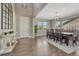 Elegant entryway with hardwood floors, high ceilings, and a view of the dining room at 6738 Esmeralda Dr, Castle Rock, CO 80108