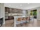 Gourmet kitchen featuring a large center island with seating, stainless steel appliances and granite countertops at 6738 Esmeralda Dr, Castle Rock, CO 80108