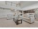 Open floor plan featuring a living room flowing into the kitchen and dining area at 6738 Esmeralda Dr, Castle Rock, CO 80108