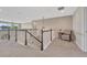 A cozy loft area featuring neutral decor and a comfortable chair, creating a relaxing space at 6738 Esmeralda Dr, Castle Rock, CO 80108