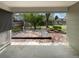 A partially covered outdoor deck overlooks a spacious backyard and greenery at 13235 Rigel Dr, Lone Tree, CO 80124