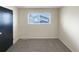 Cozy bedroom with soft carpet, neutral colored walls, and window with neighborhood views at 13235 Rigel Dr, Lone Tree, CO 80124