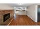 Inviting living room features a brick fireplace and opens to a bright, modern kitchen space at 13235 Rigel Dr, Lone Tree, CO 80124