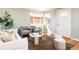 Stylish living room with hardwood floors, comfortable seating, and a bright window, creating a welcoming space at 3216 N Saint Paul St, Denver, CO 80205