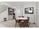 Modern dining area with built-in bar, mini fridge and floating shelves, perfect for entertaining guests at 2840 S Bannock St, Englewood, CO 80110